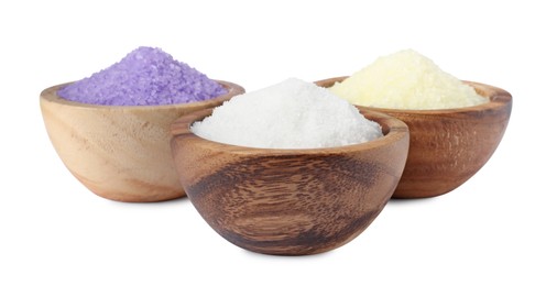 Photo of Wooden bowls with different sea salt on white background