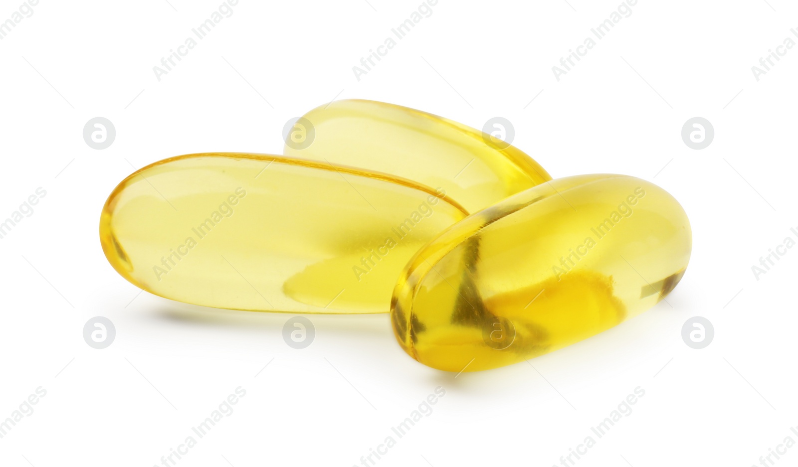 Photo of Many yellow vitamin capsules isolated on white