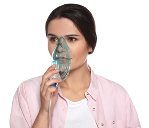 Photo of Young woman using nebulizer on white background