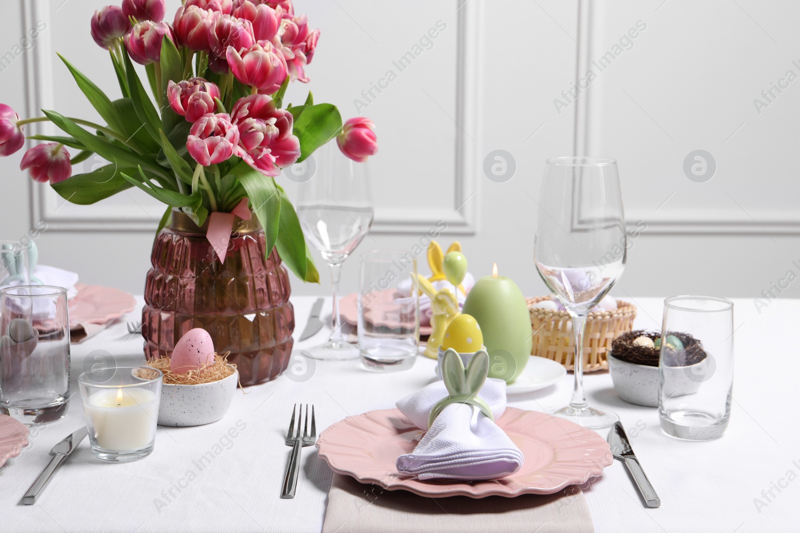 Photo of Festive table setting with beautiful flowers. Easter celebration