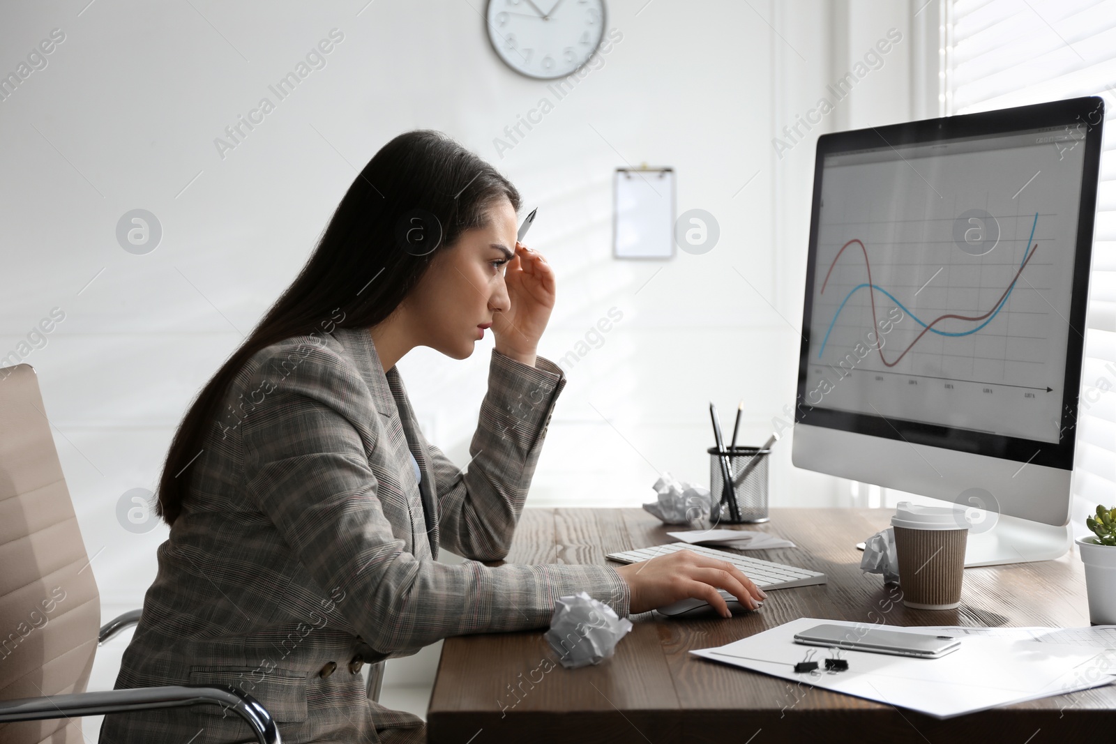 Photo of Businesswoman stressing out at workplace in office