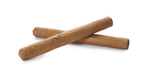 Cigars wrapped in tobacco leaves on white background