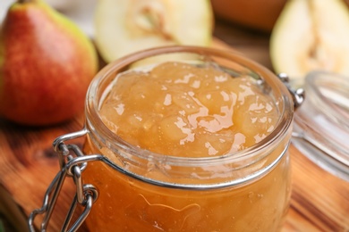 Delicious pear jam in glass jar, closeup