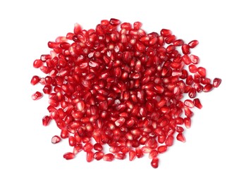Tasty pomegranate seeds on white background, top view