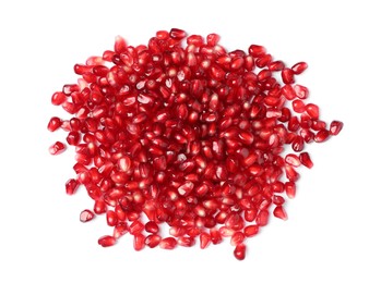 Photo of Tasty pomegranate seeds on white background, top view