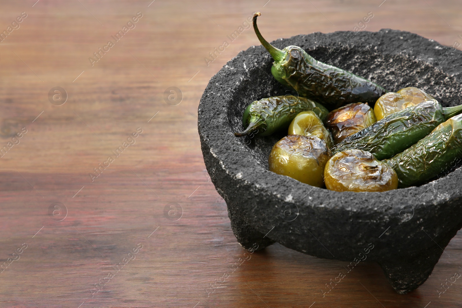 Photo of Different ingredients for cooking tasty salsa sauce on wooden table, closeup. Space for text