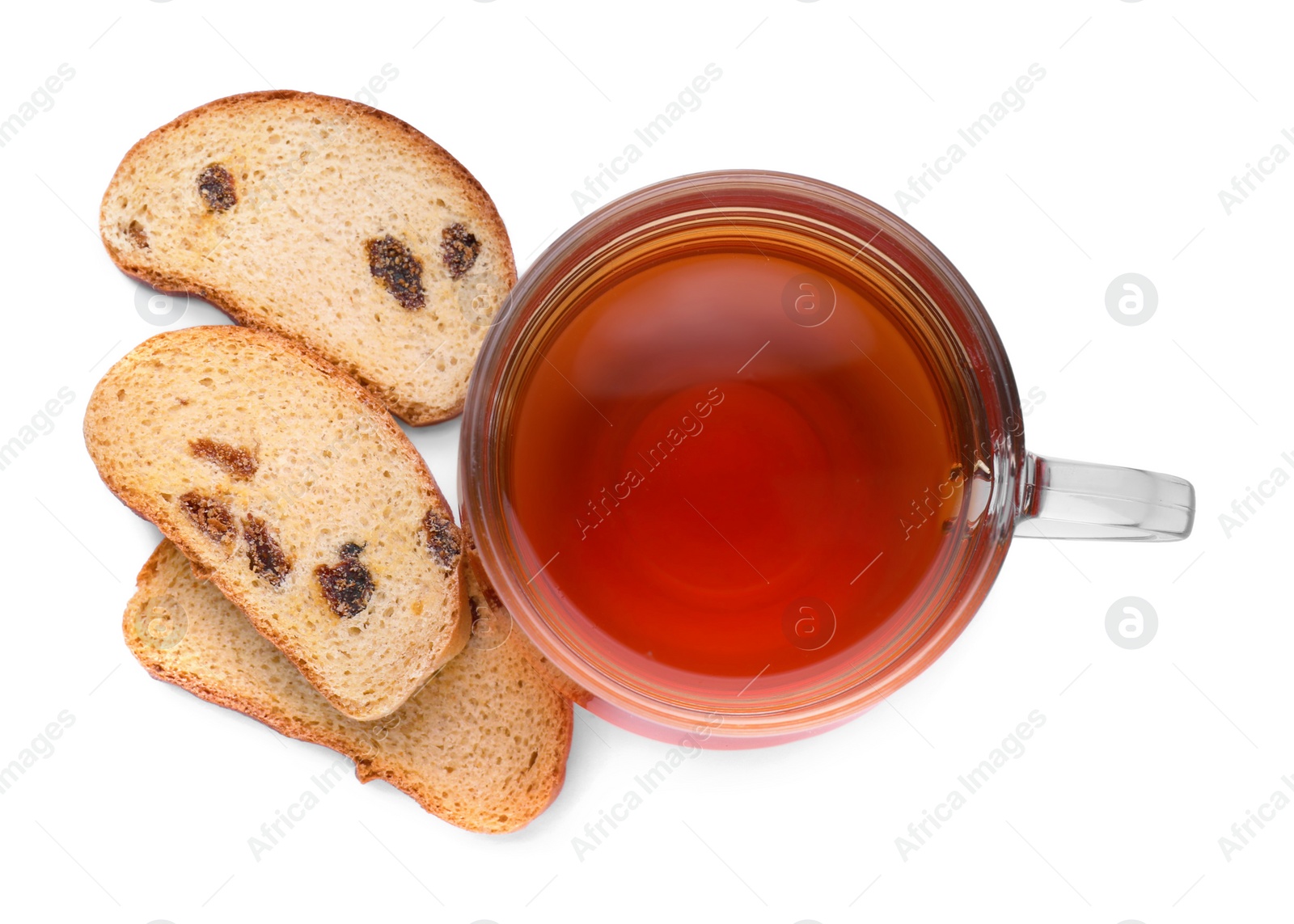 Photo of Sweet hard chuck crackers with raisins and cup of tea on white background, top view