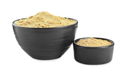 Photo of Bowls with aromatic mustard powder on white background