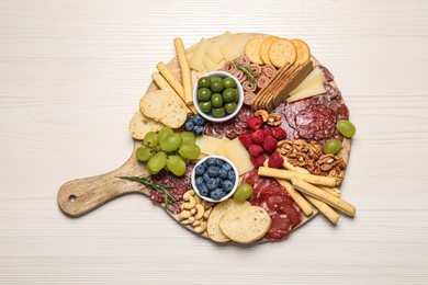 Photo of Tasty parmesan cheese and other different appetizers on white wooden table, top view