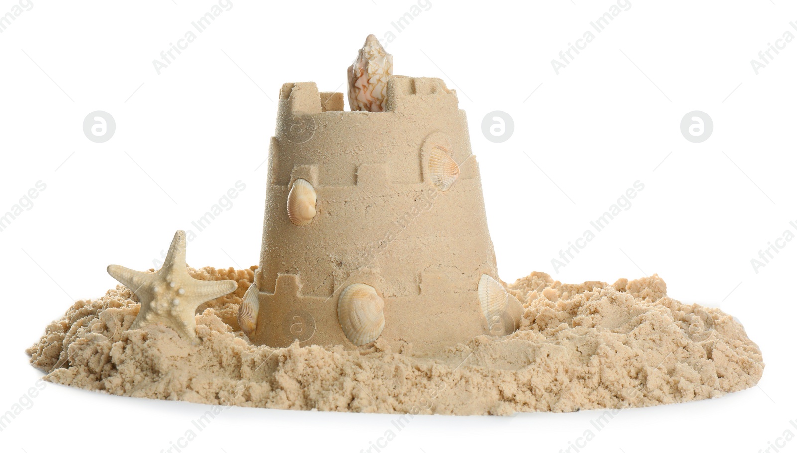 Photo of Sand castle with shells and starfish on white background. Outdoor play