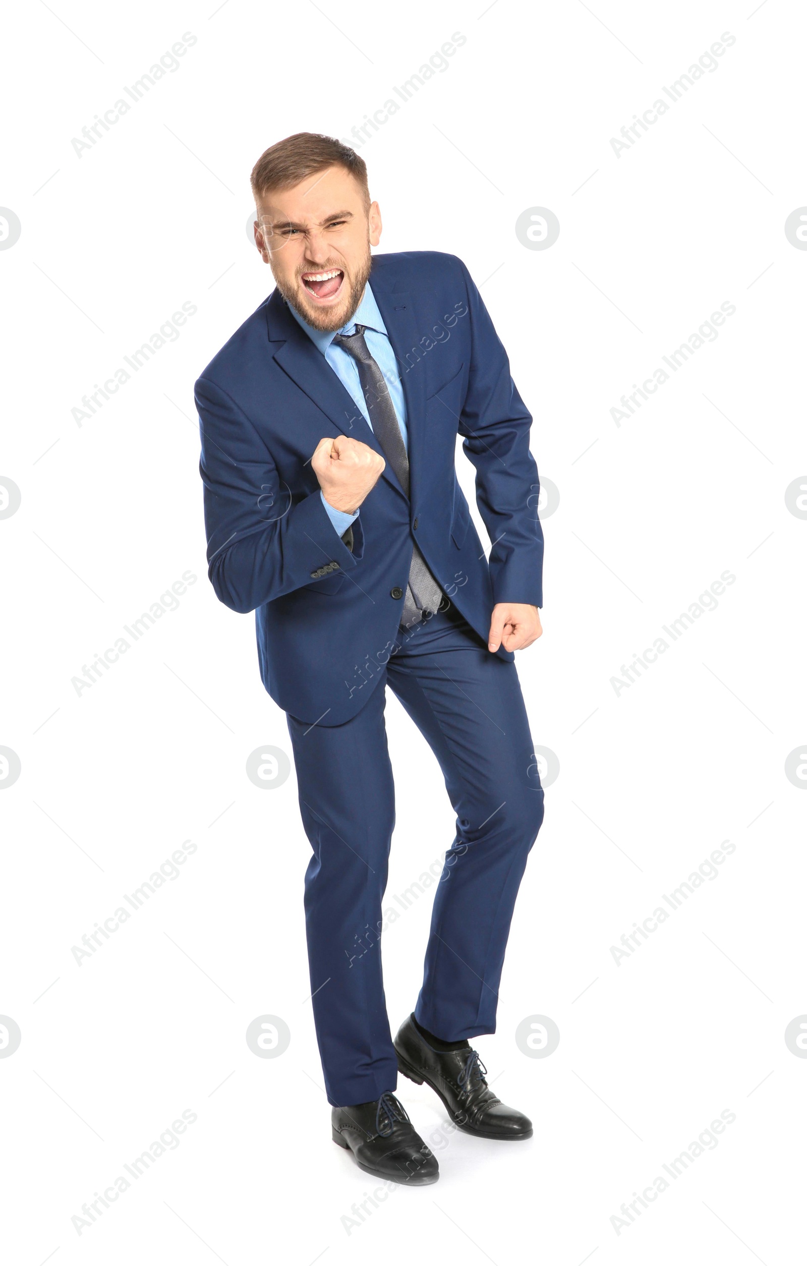 Photo of Young businessman celebrating victory on white background