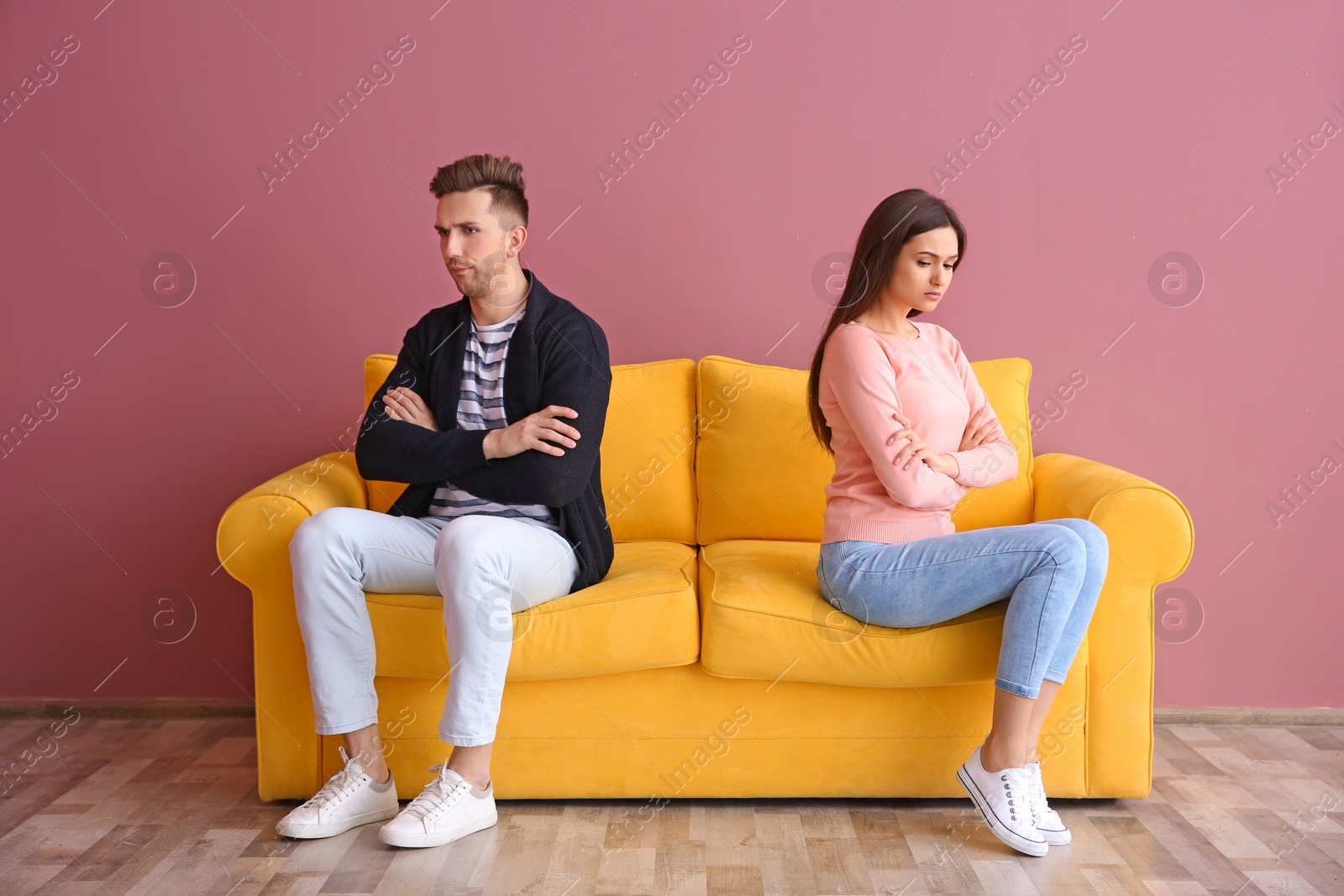 Photo of Young couple on sofa, indoors