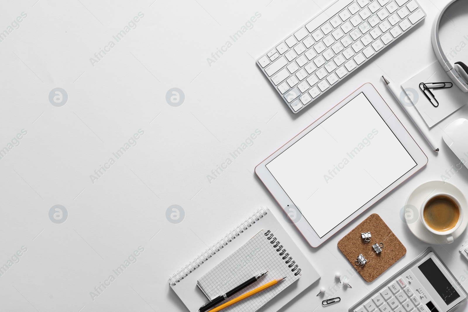 Photo of Flat lay composition with modern tablet on white background. Space for text