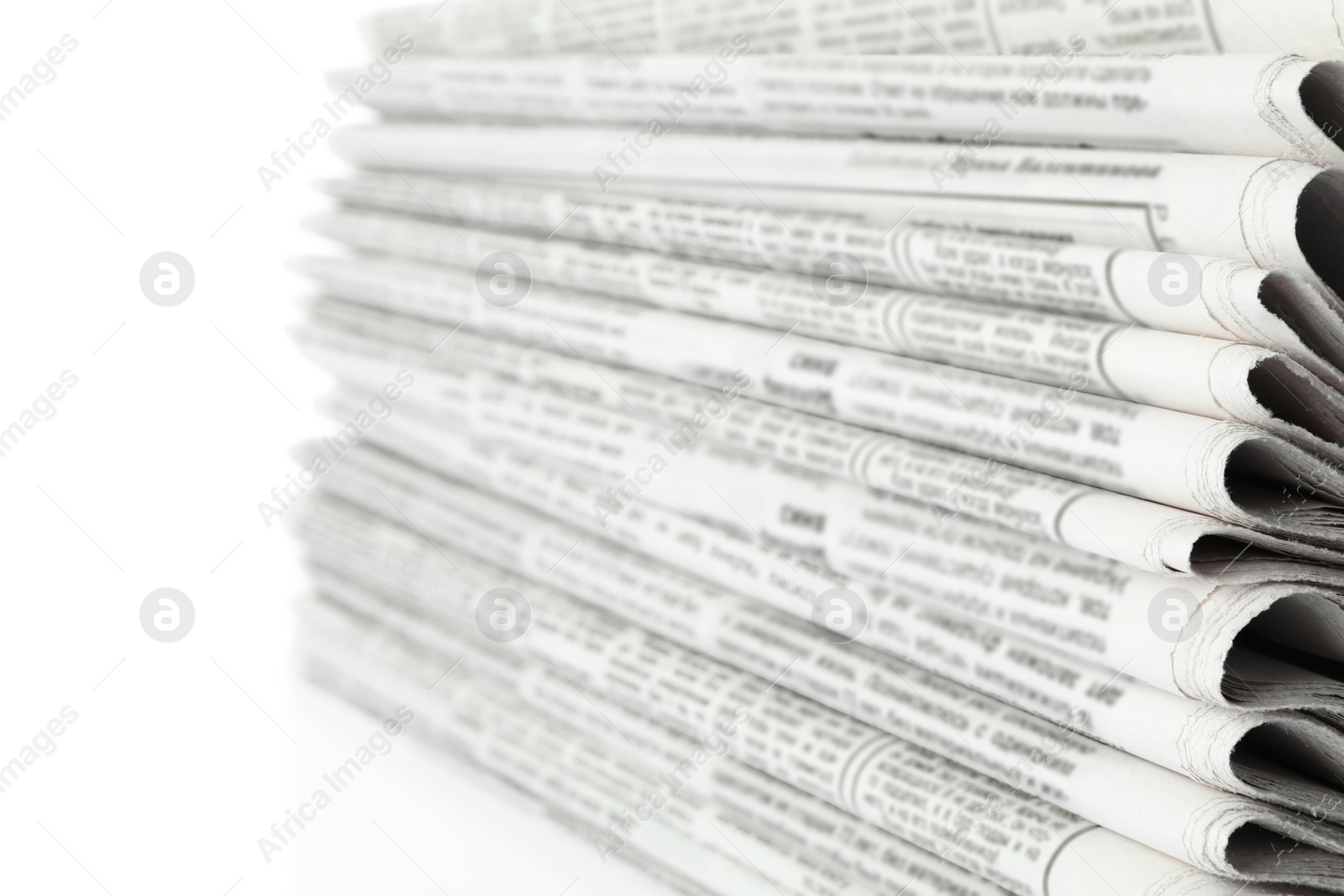 Photo of Stack of newspapers on white background, closeup. Journalist's work