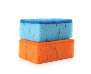Photo of Bright cleaning sponges with abrasive scourers on white background