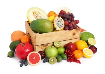 Many different fresh fruits and wooden crate isolated on white