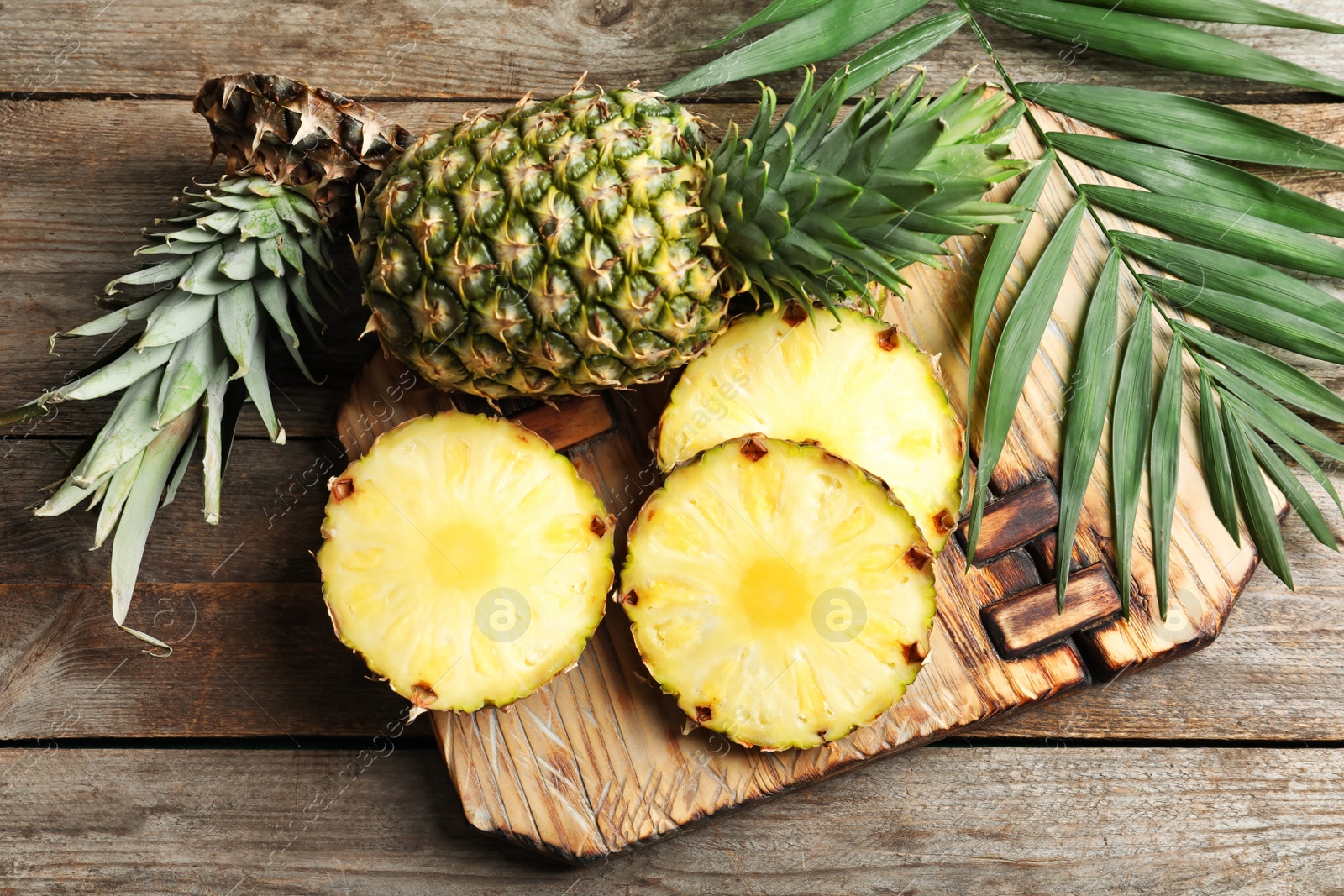 Photo of Fresh pineapple on wooden board