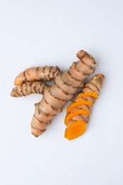 Fresh turmeric roots isolated on white, top view