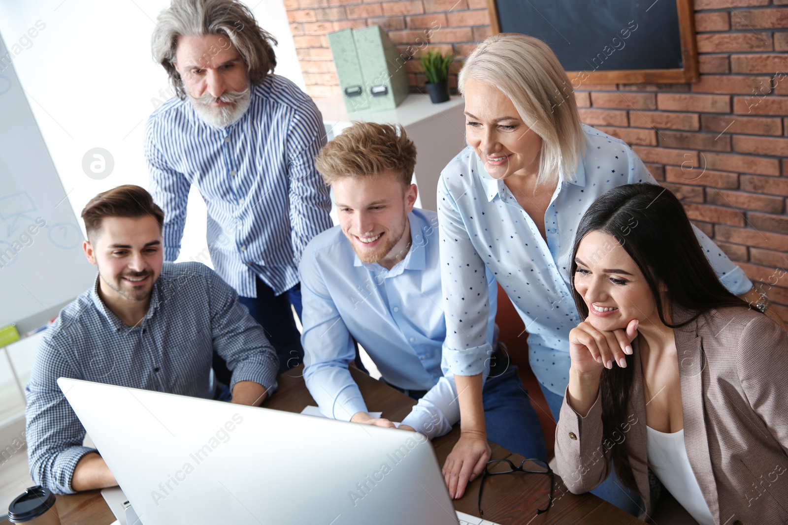 Photo of Business people discussing work matters at table in office. Professional communication