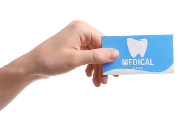 Photo of Woman holding business card isolated on white, closeup. Dental medical service