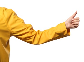 Woman showing hitchhiking gesture on white background, closeup