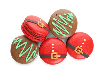 Photo of Beautifully decorated Christmas macarons on white background, top view