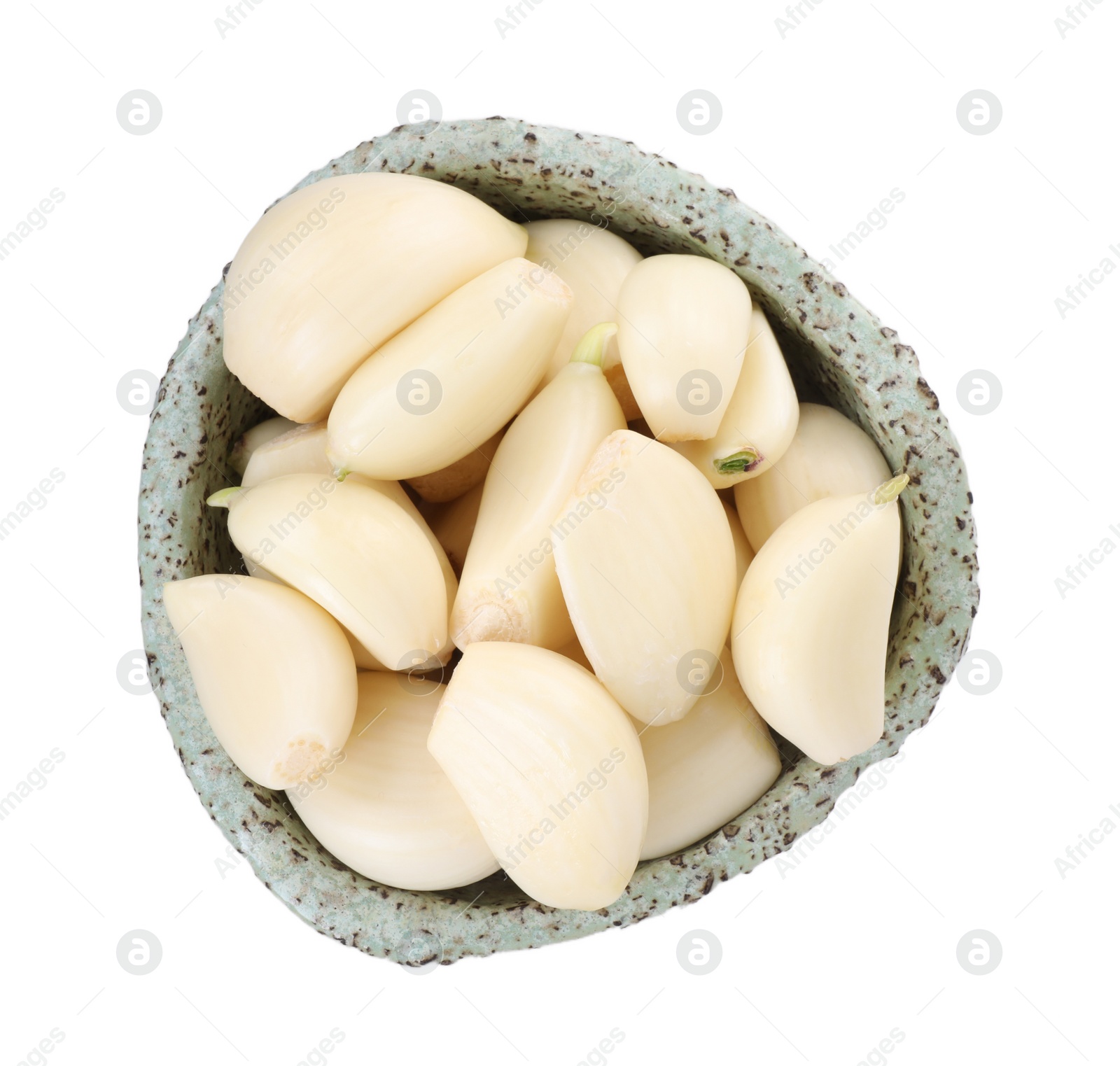 Photo of Peeled cloves of fresh garlic in bowl isolated on white, top view