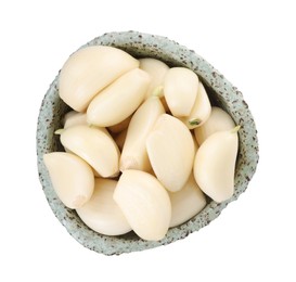 Photo of Peeled cloves of fresh garlic in bowl isolated on white, top view