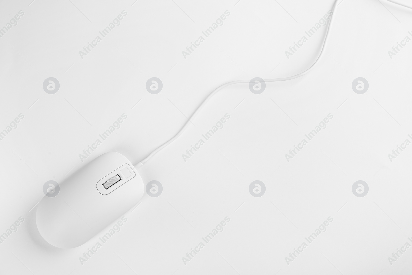 Photo of Modern wired optical mouse on white background, top view