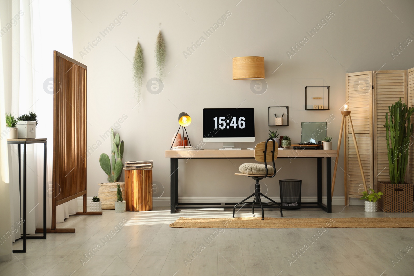 Photo of Room interior with comfortable workplace. Modern computer on wooden desk