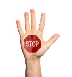 Woman showing palm with drawn STOP sign on white background, closeup