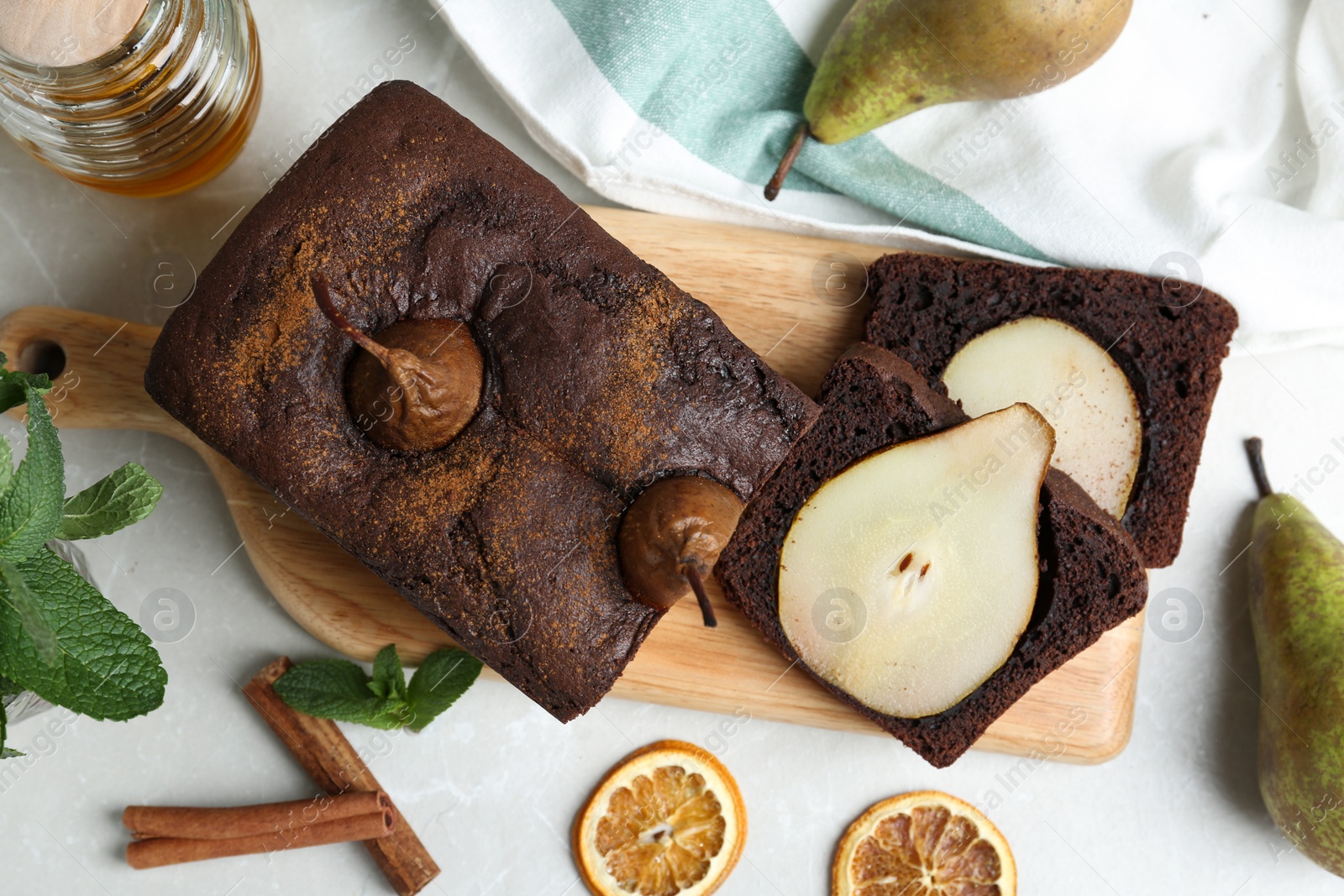 Photo of Flat lay composition with tasty pear bread on light grey marble table. Homemade cake