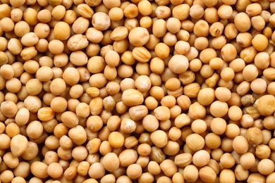 Photo of Many whole mustard seeds as background, closeup