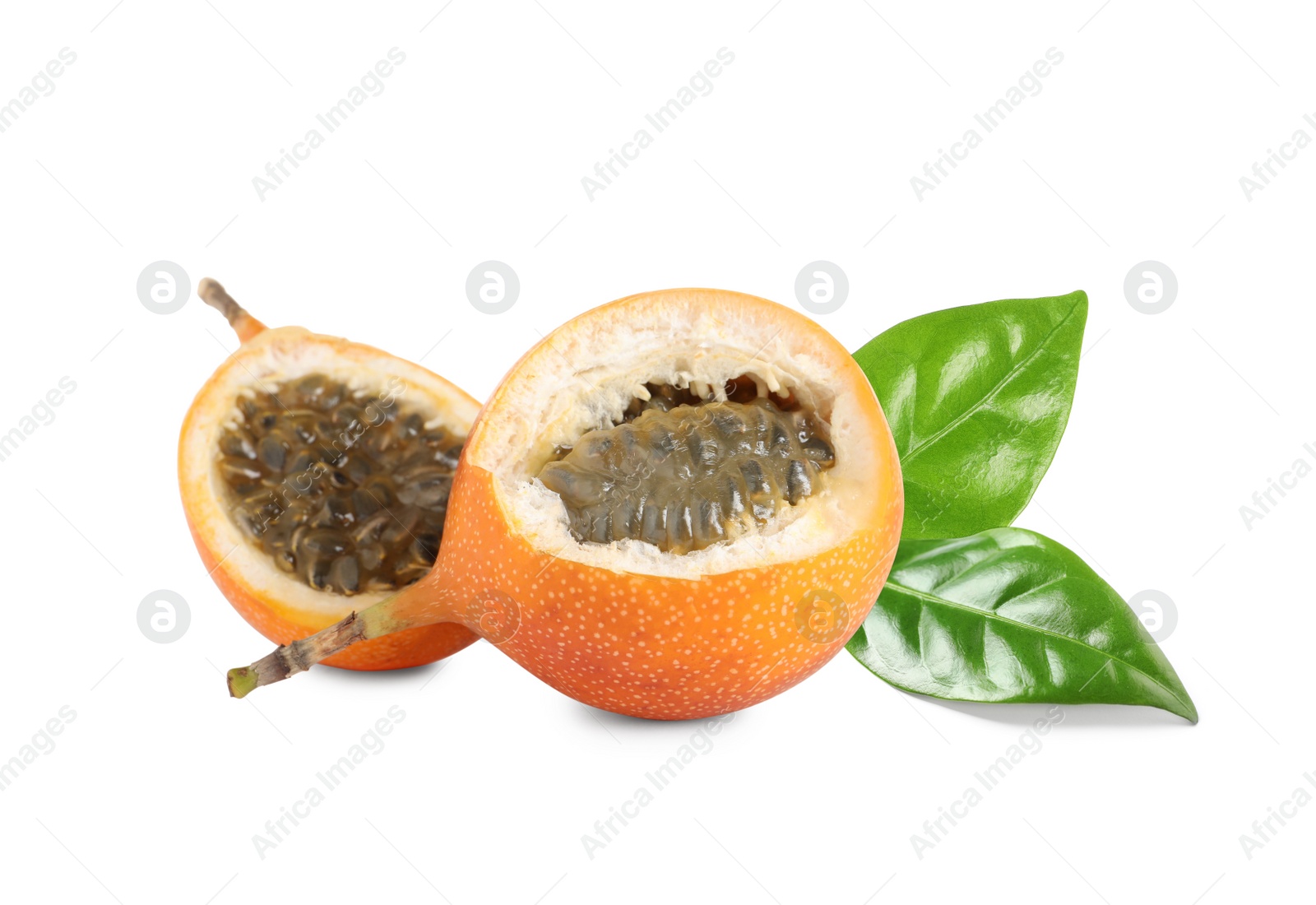 Image of Tasty ripe granadillas and green leaves on white background