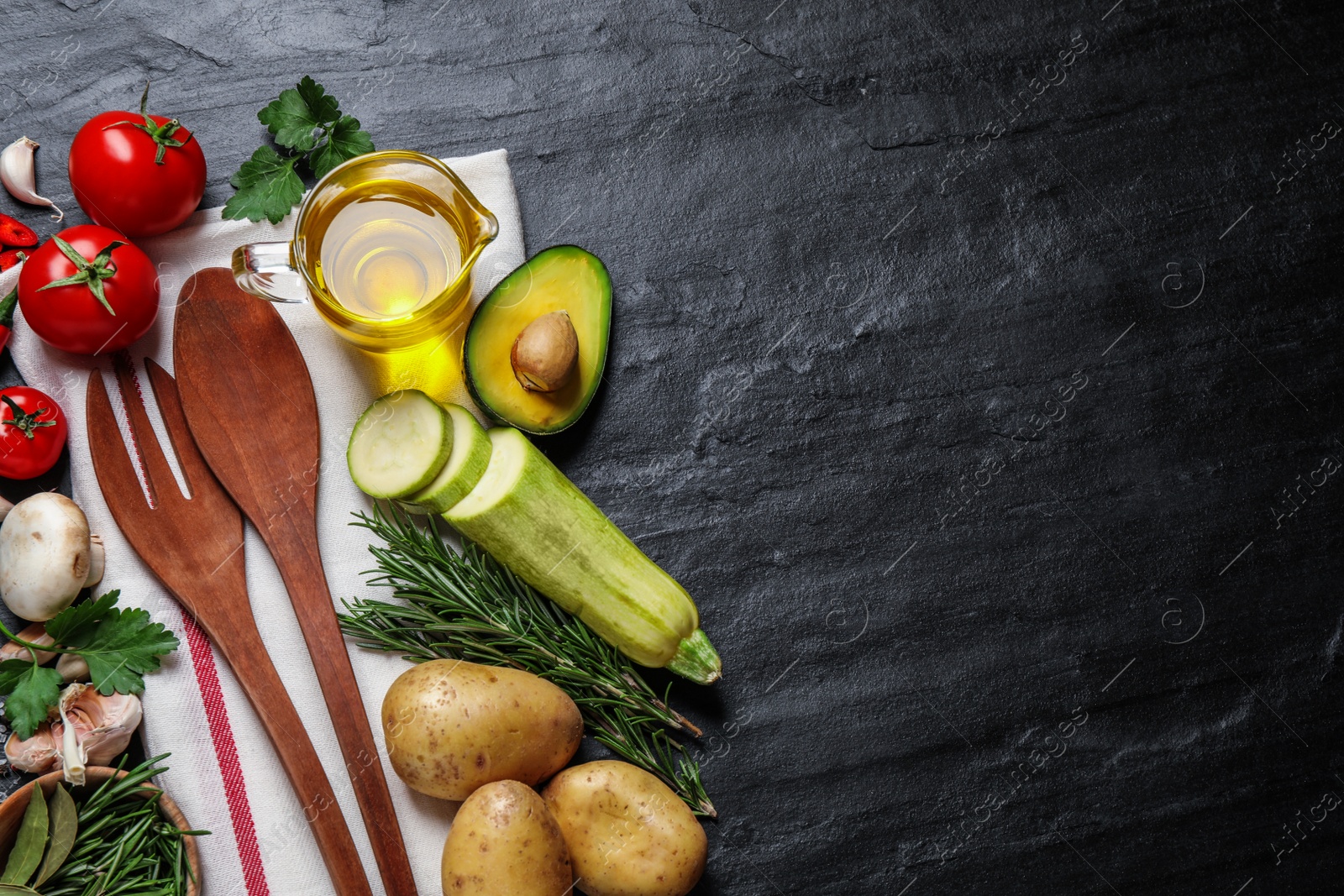 Photo of Flat lay composition with fresh products on grey table, space for text. Healthy cooking