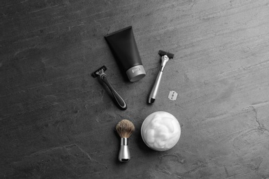 Photo of Flat lay composition with men's cosmetic products on grey background. Space for design