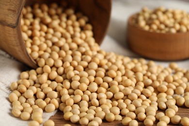 Photo of Natural soy beans on wooden table, closeup