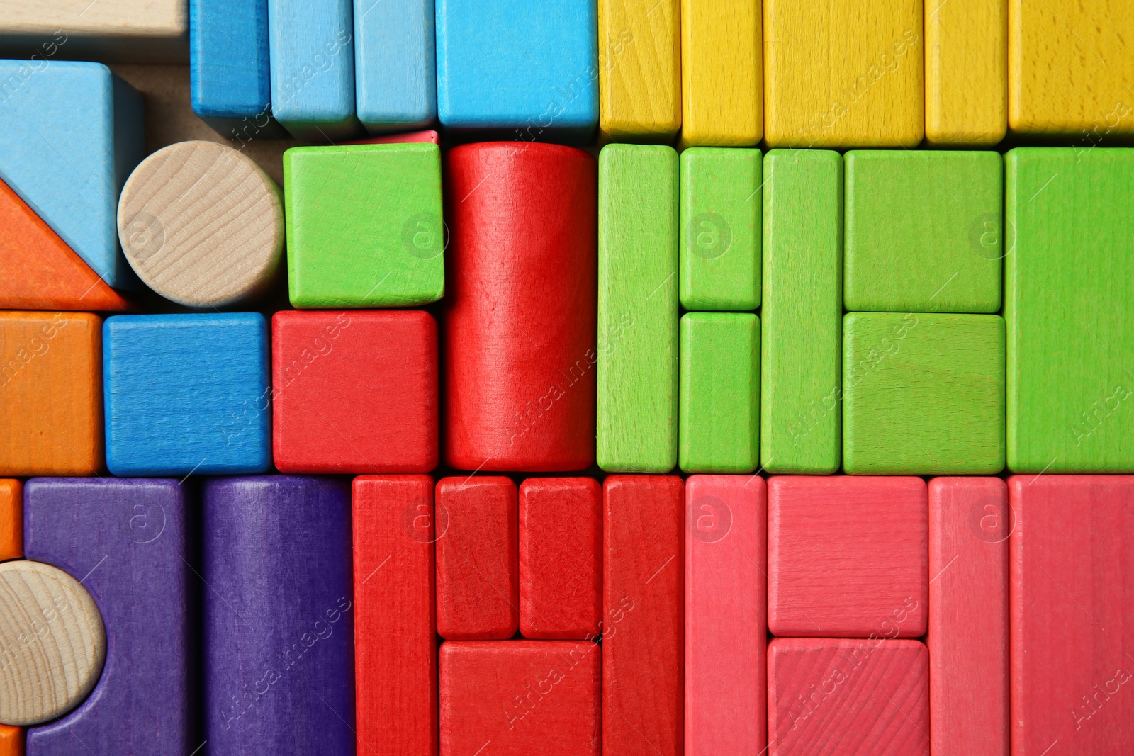 Photo of Wooden construction set as background, top view