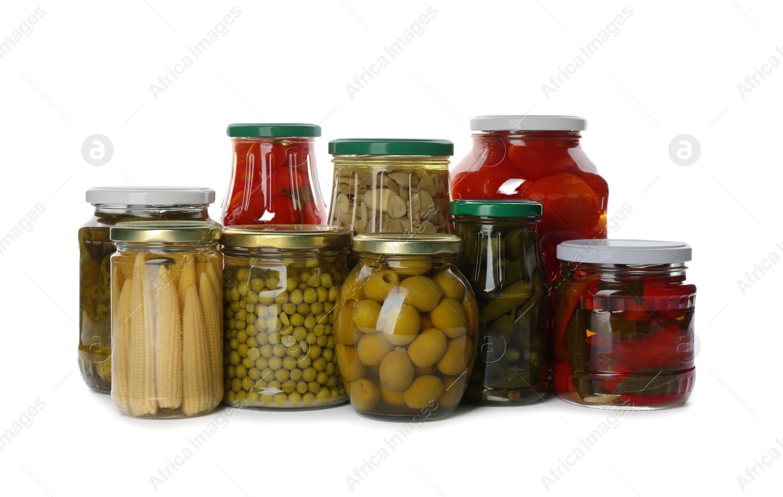 Photo of Glass jars with different pickled vegetables and mushrooms on white background