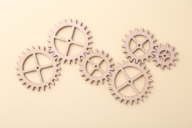 Business process organization and optimization. Scheme with wooden figures on beige background, top view