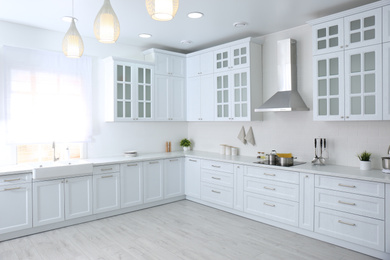 Photo of Beautiful kitchen interior with new stylish furniture