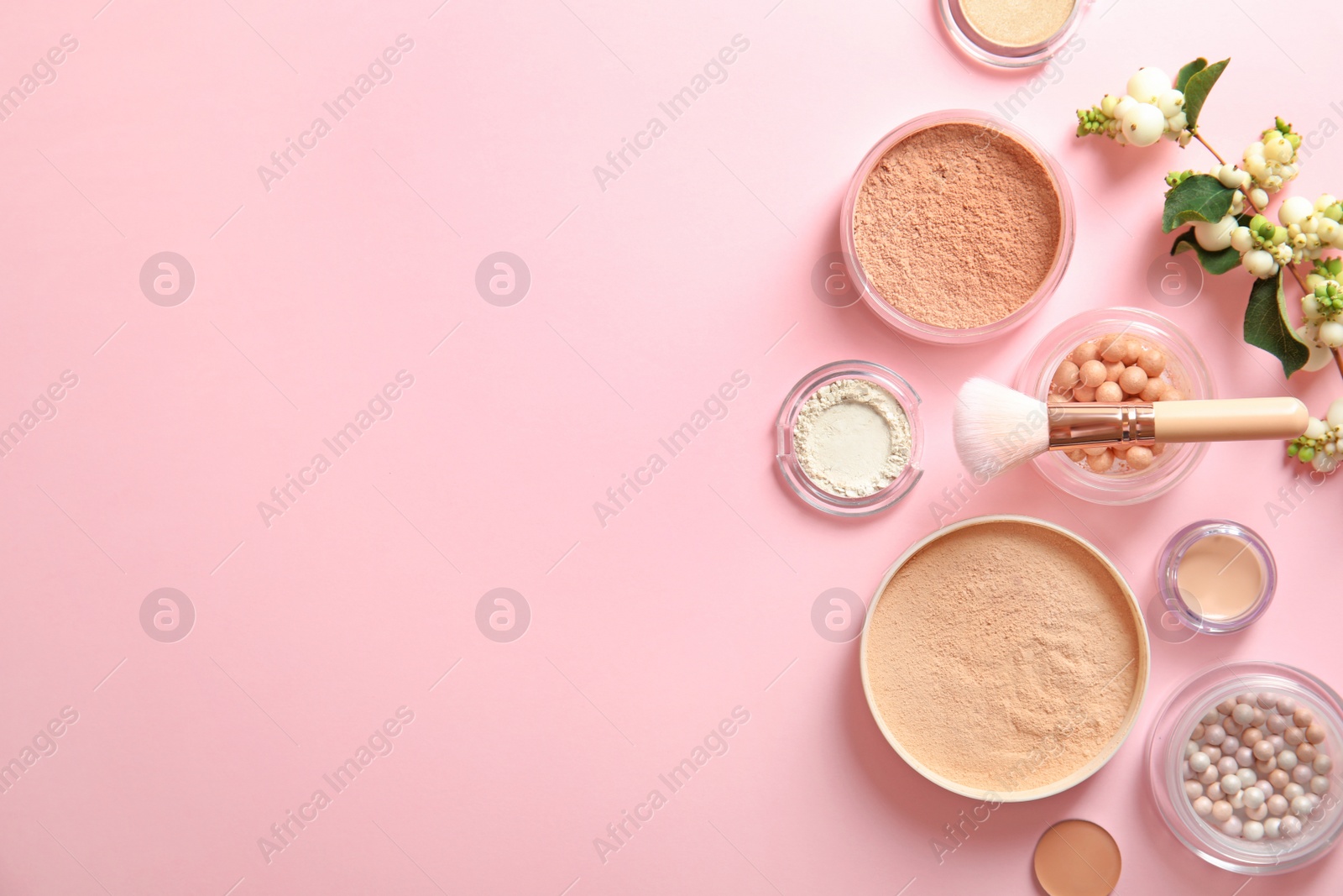 Photo of Flat lay composition with various makeup face powders on color background. Space for text