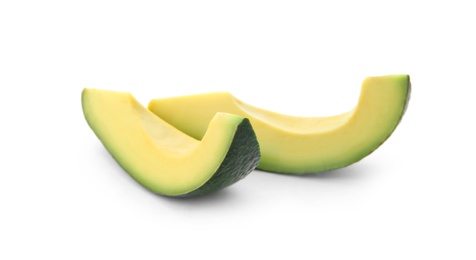 Photo of Slices of ripe avocado on white background