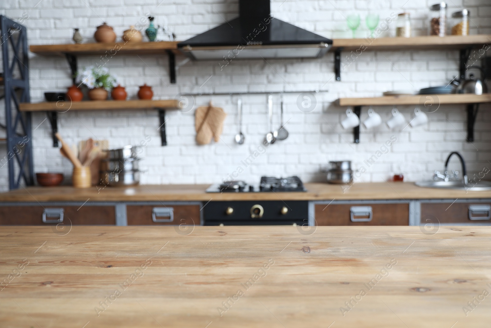 Photo of Empty wooden table in beautiful kitchen. Interior design