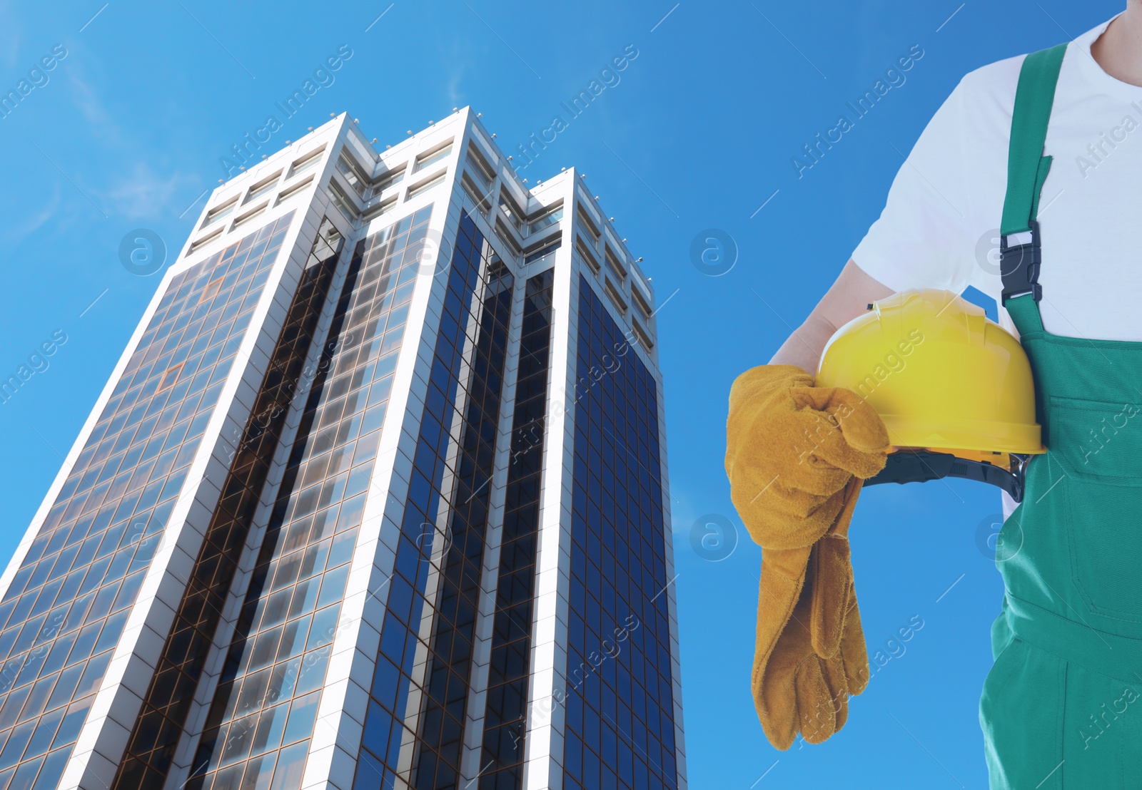 Image of Double exposure of engineer and modern buildings