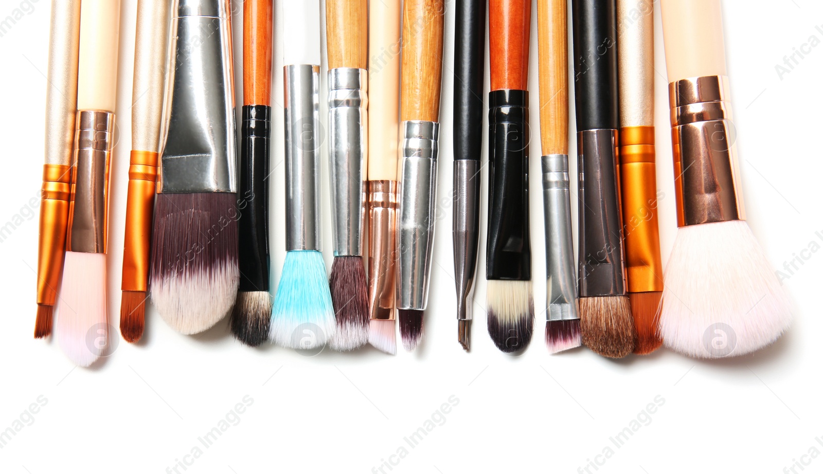 Photo of Makeup brushes of professional artist on white background