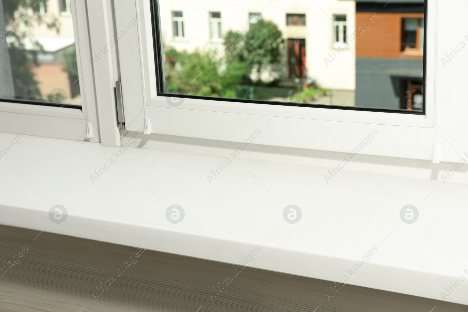 Photo of Window with empty white sill, closeup view