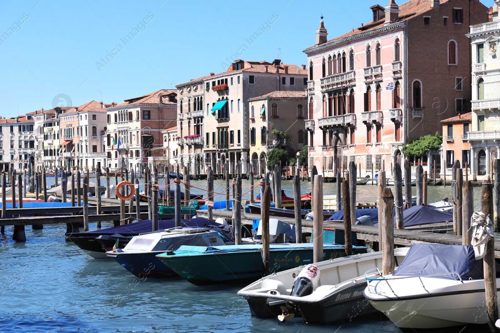 Photo of VENICE, ITALY - JUNE 13, 2019: View of Grand Canal with different boats at pier