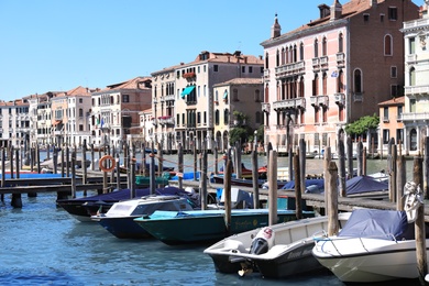 VENICE, ITALY - JUNE 13, 2019: View of Grand Canal with different boats at pier