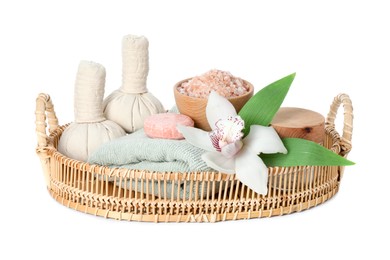 Photo of Spa composition. Towel, herbal massage bags, sea salt, soap and beautiful flower on white background